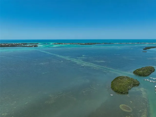 a view of a an ocean and a yard