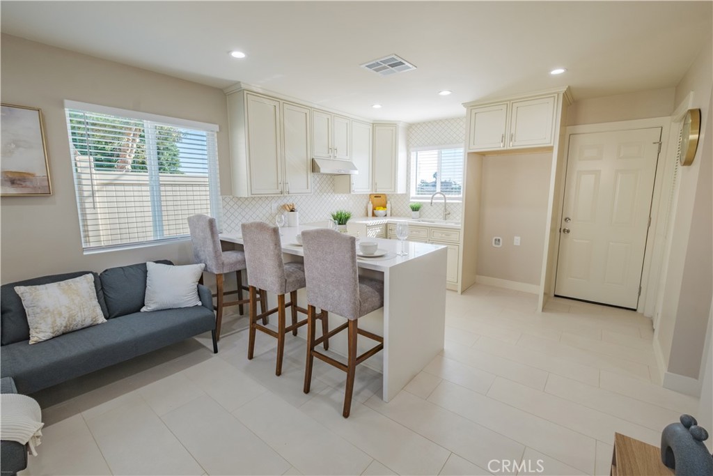 223 South Aprilia Avenue Compton, CA 90220 - Photo 30 of 46 a view of a dining room with furniture