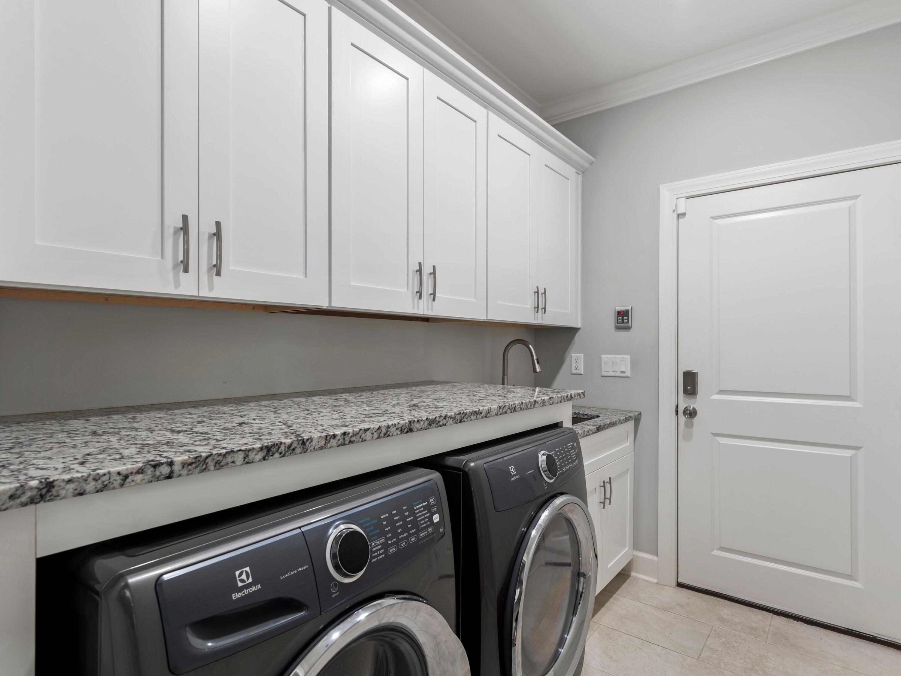 179 Lake Park Cove Santa Rosa Beach, FL 32459 - Photo 36 of 69 Laundry with cabinets and sink