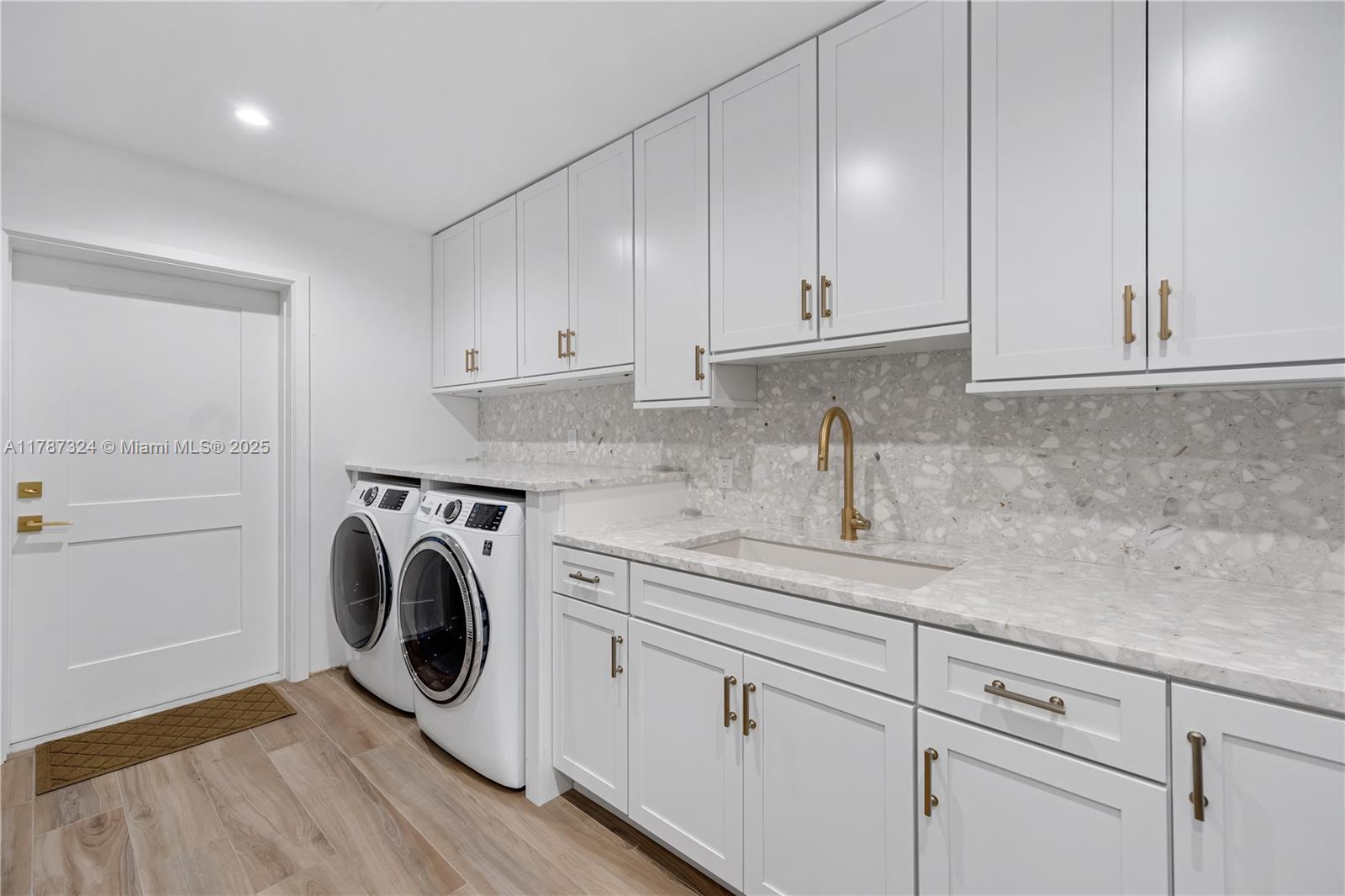 64 Tarpon Lane Key Largo, FL 33037 - Photo 14 of 22 a utility room with sink dryer and washer