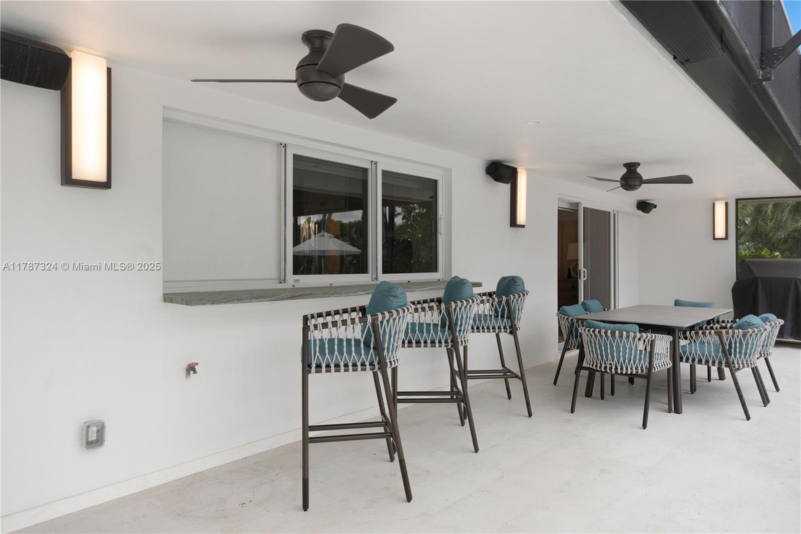 64 Tarpon Lane Key Largo, FL 33037 - Photo 16 of 22 a dining room with furniture and window