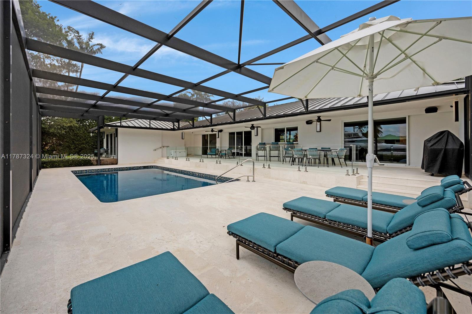 64 Tarpon Lane Key Largo, FL 33037 - Photo 17 of 22 a view of a patio with a table and chairs