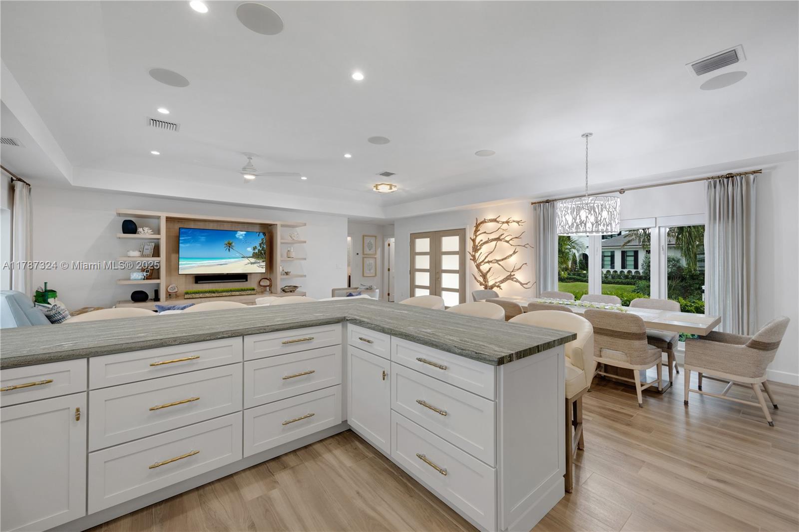 64 Tarpon Lane Key Largo, FL 33037 - Photo 7 of 22 a kitchen with sink stove and cabinets