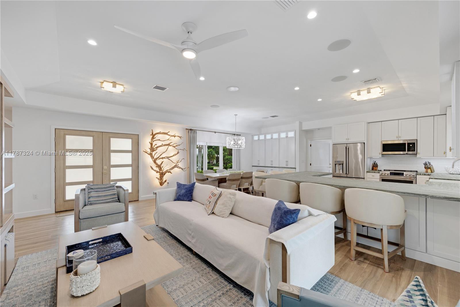 64 Tarpon Lane Key Largo, FL 33037 - Photo 8 of 22 a living room with furniture and a wooden floor