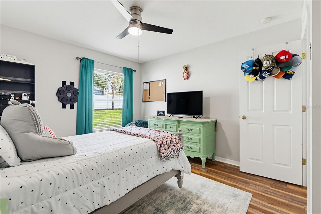 3497 Chadwick Avenue Spring Hill, FL 34609 - Photo 29 of 47 a bedroom with a bed and a flat screen tv