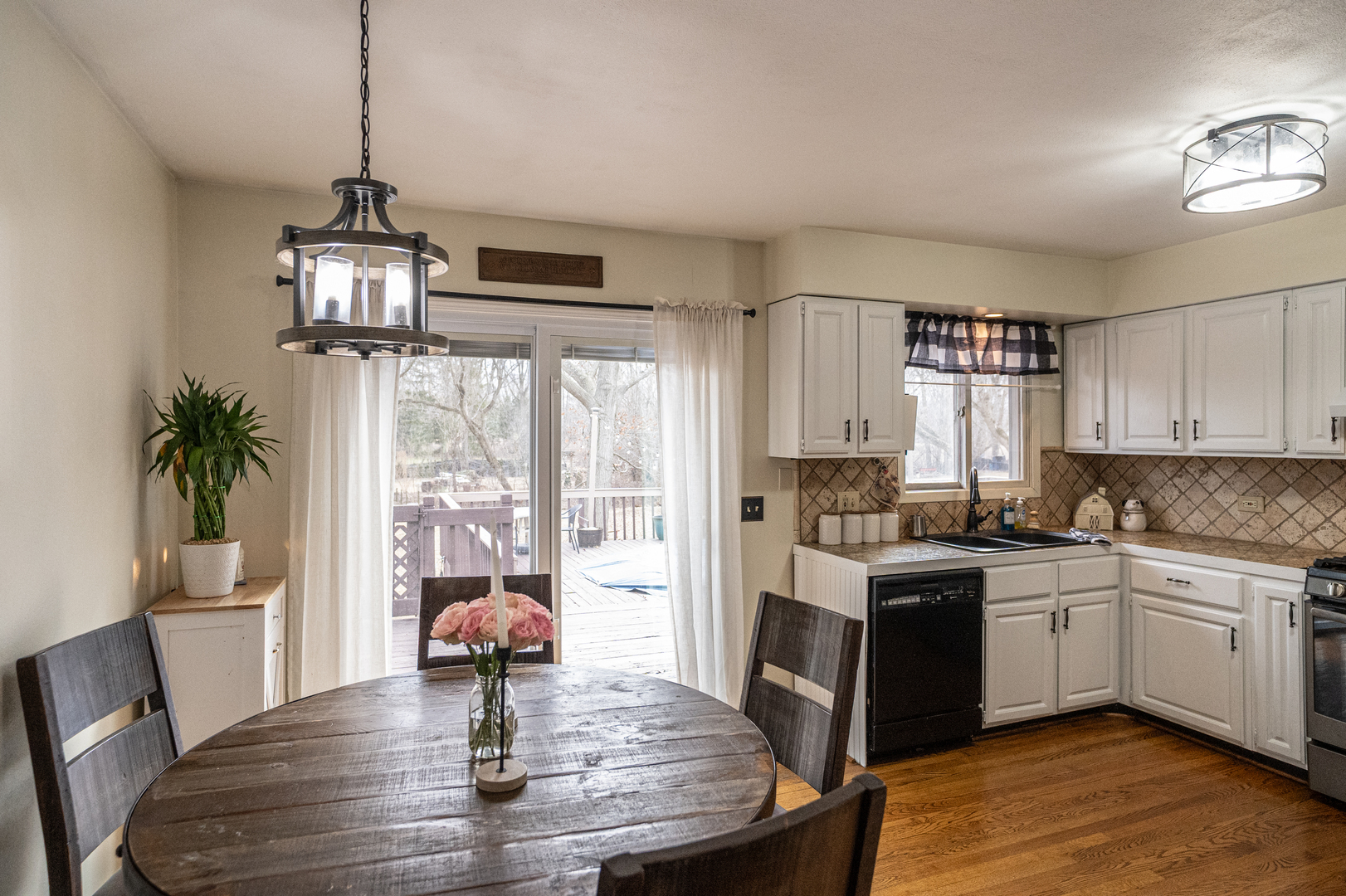 1403 West Beach Road Waukegan, IL 60087 - Photo 15 of 59 a kitchen with stainless steel appliances granite countertop a stove and refrigerator