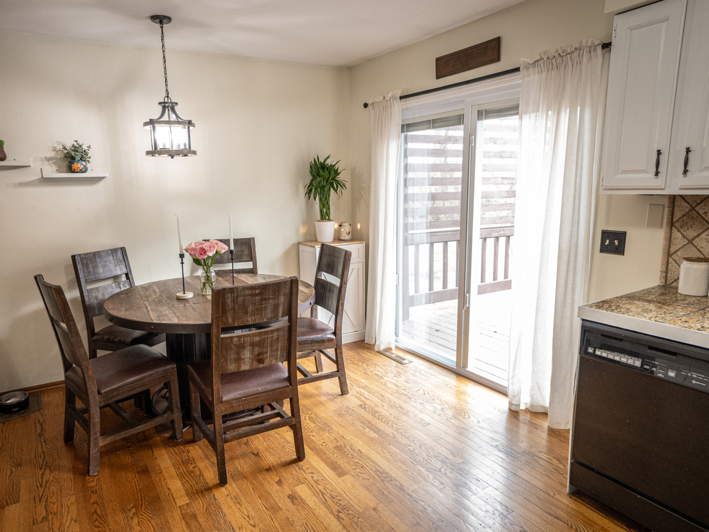 1403 West Beach Road Waukegan, IL 60087 - Photo 16 of 59 a view of a dining room with furniture window and wooden floor
