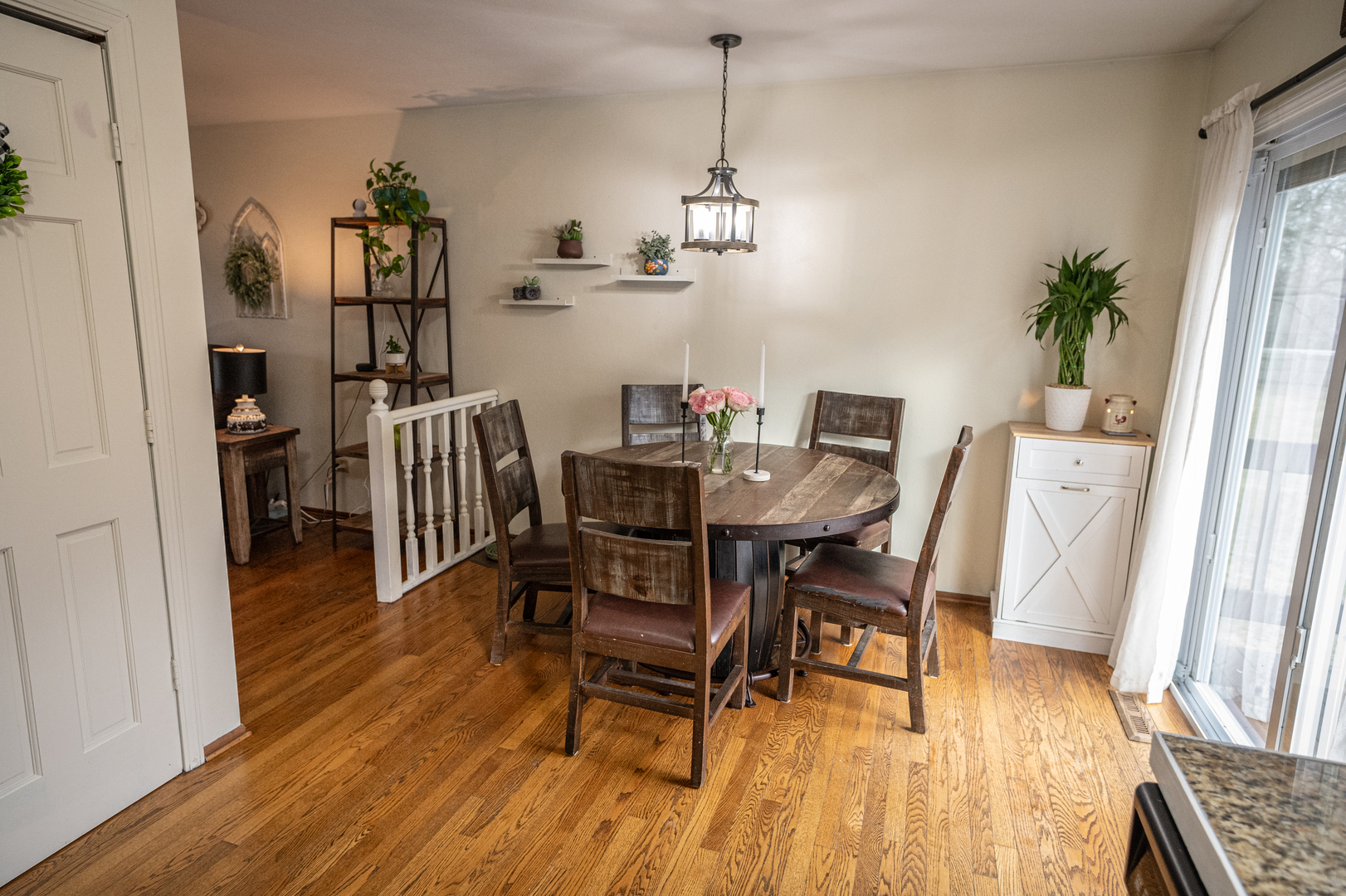 1403 West Beach Road Waukegan, IL 60087 - Photo 18 of 59 a view of a dining room with furniture and wooden floor