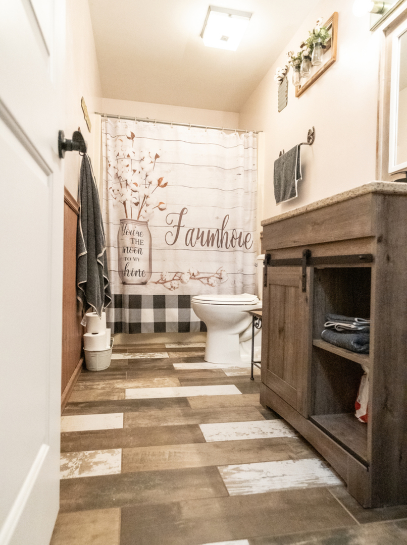 1403 West Beach Road Waukegan, IL 60087 - Photo 23 of 59 a bathroom with a toilet and a shower