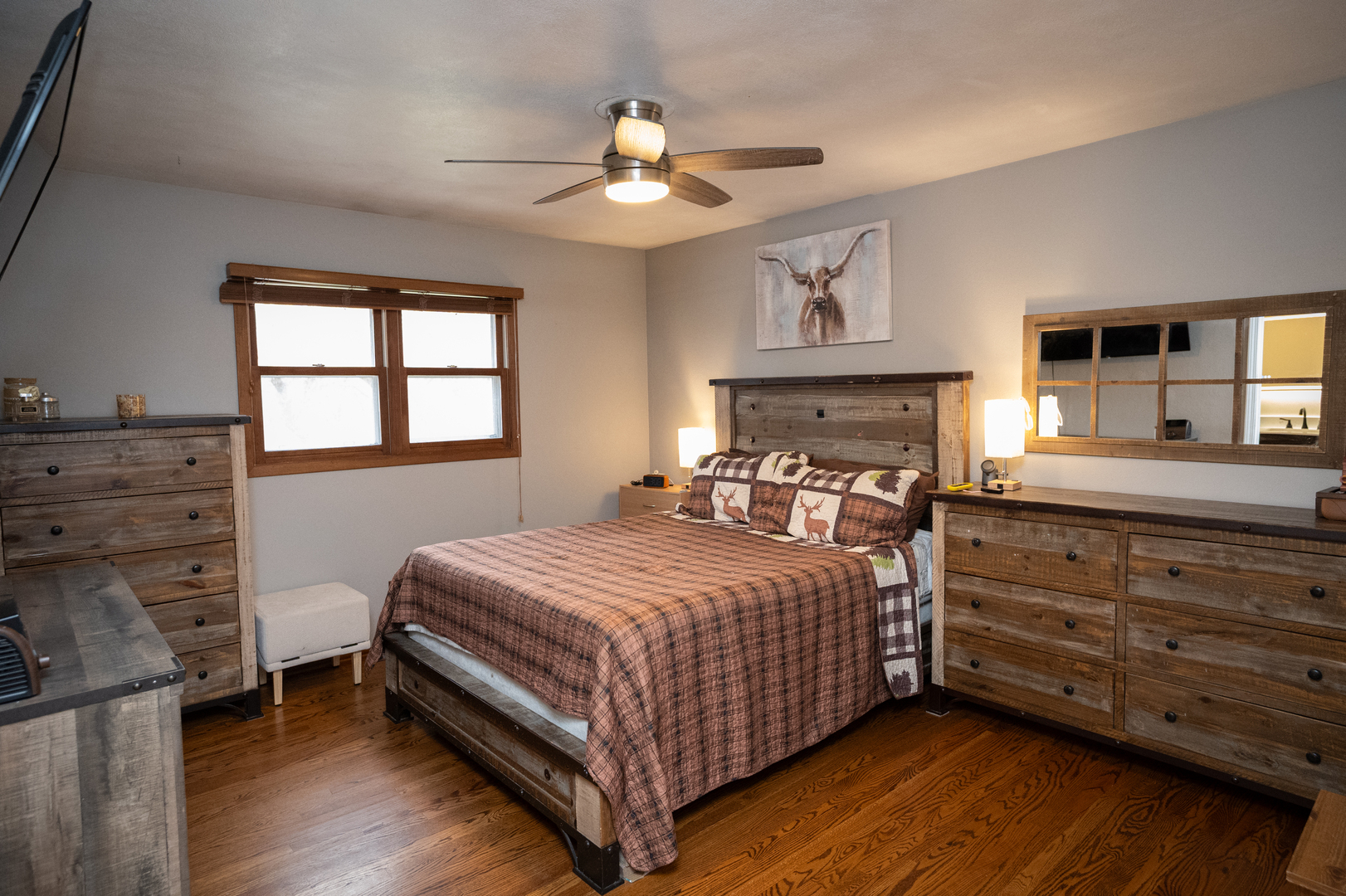 1403 West Beach Road Waukegan, IL 60087 - Photo 28 of 59 a bedroom with a bed and wooden floor