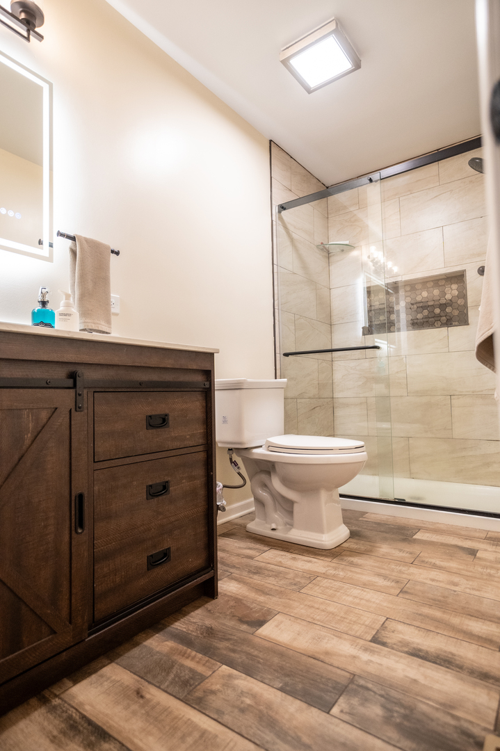 1403 West Beach Road Waukegan, IL 60087 - Photo 33 of 59 a bathroom with a sink and a toilet