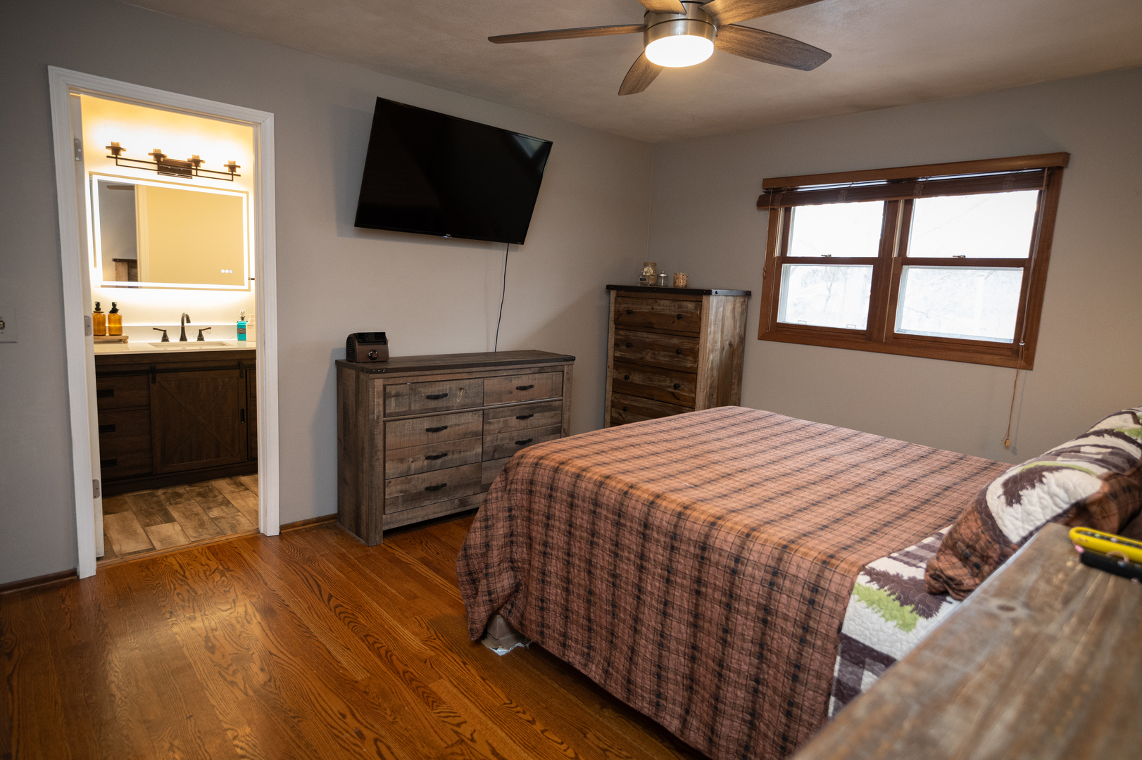 1403 West Beach Road Waukegan, IL 60087 - Photo 34 of 59 a bedroom with a bed and a flat screen tv