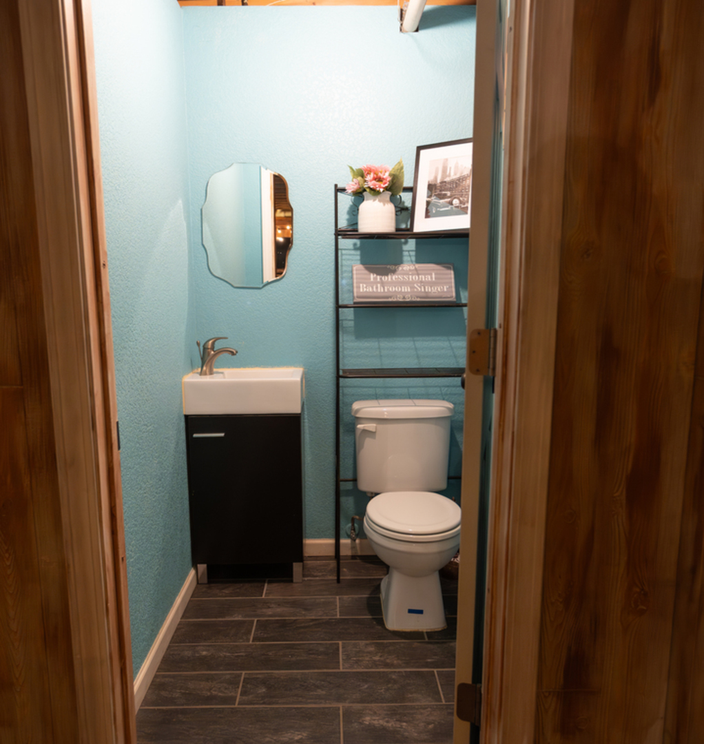 1403 West Beach Road Waukegan, IL 60087 - Photo 38 of 59 a bathroom with a toilet and a mirror