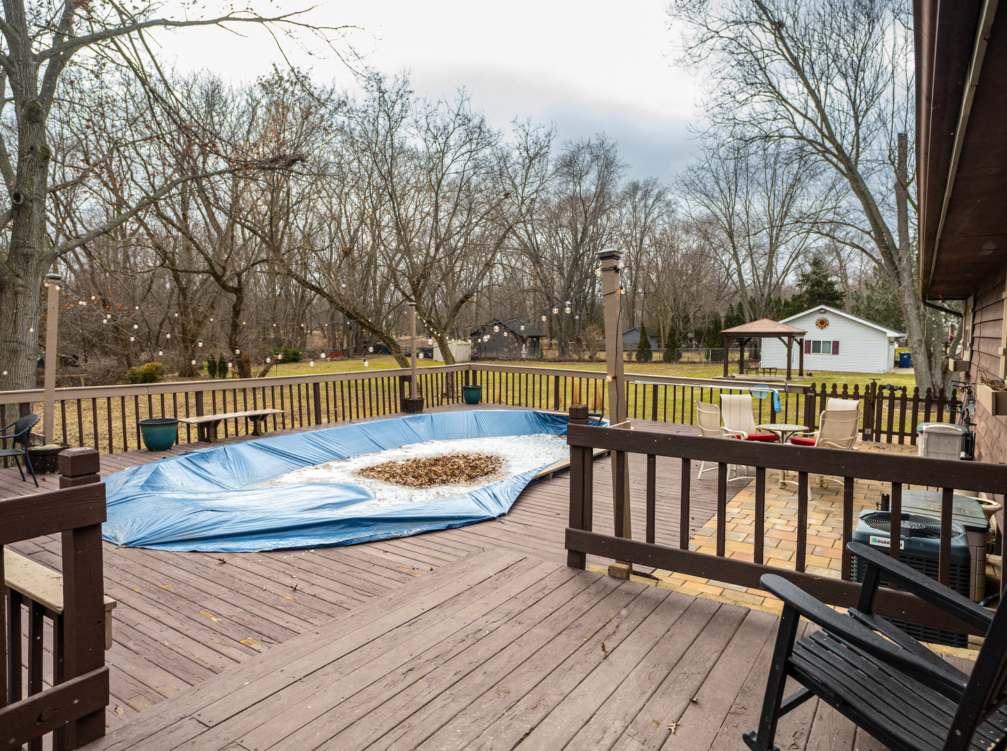 1403 West Beach Road Waukegan, IL 60087 - Photo 45 of 59 a view of a roof deck with wooden floor and fence