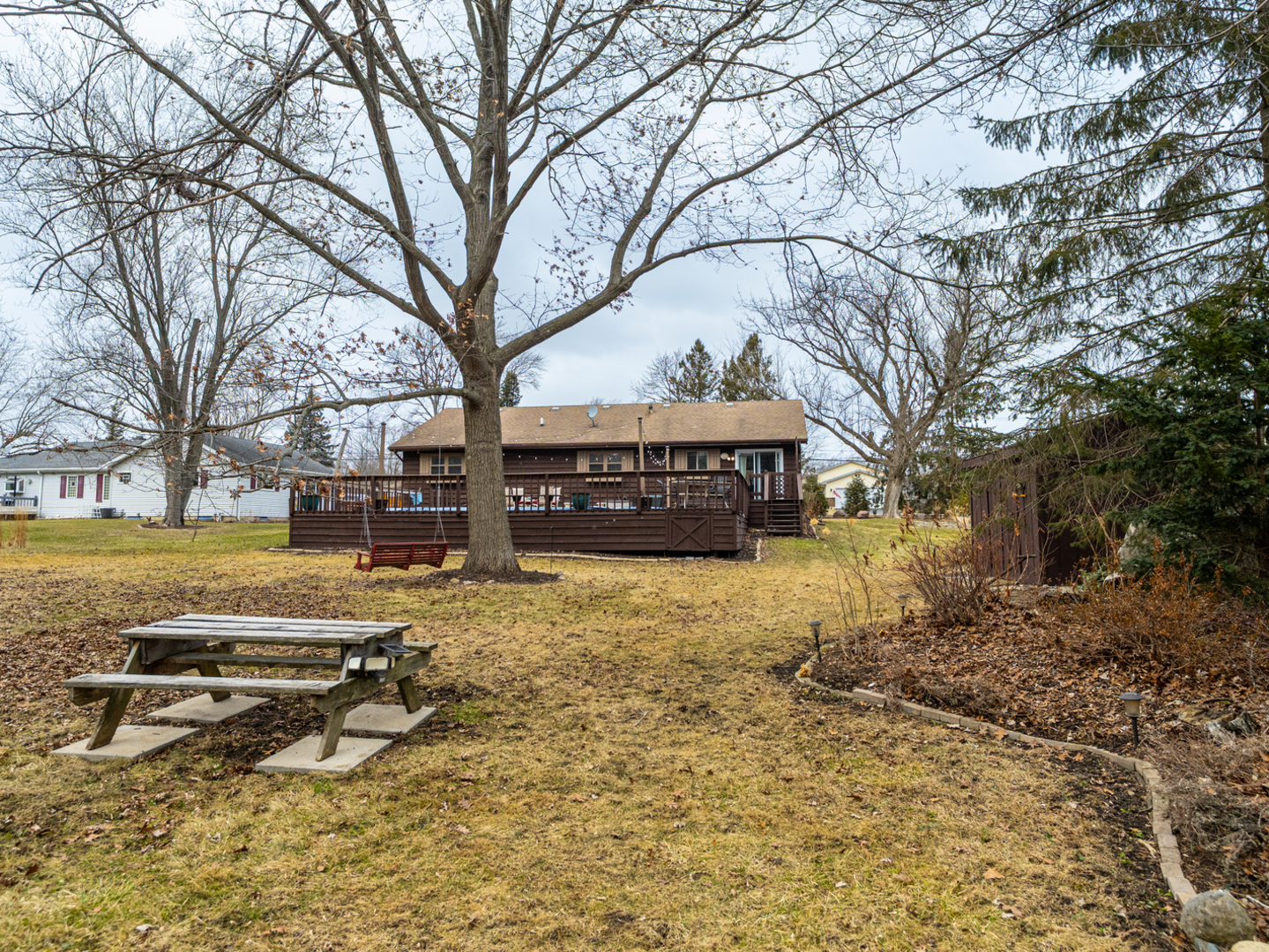 1403 West Beach Road Waukegan, IL 60087 - Photo 49 of 59 a view of a yard with trees and brick wall