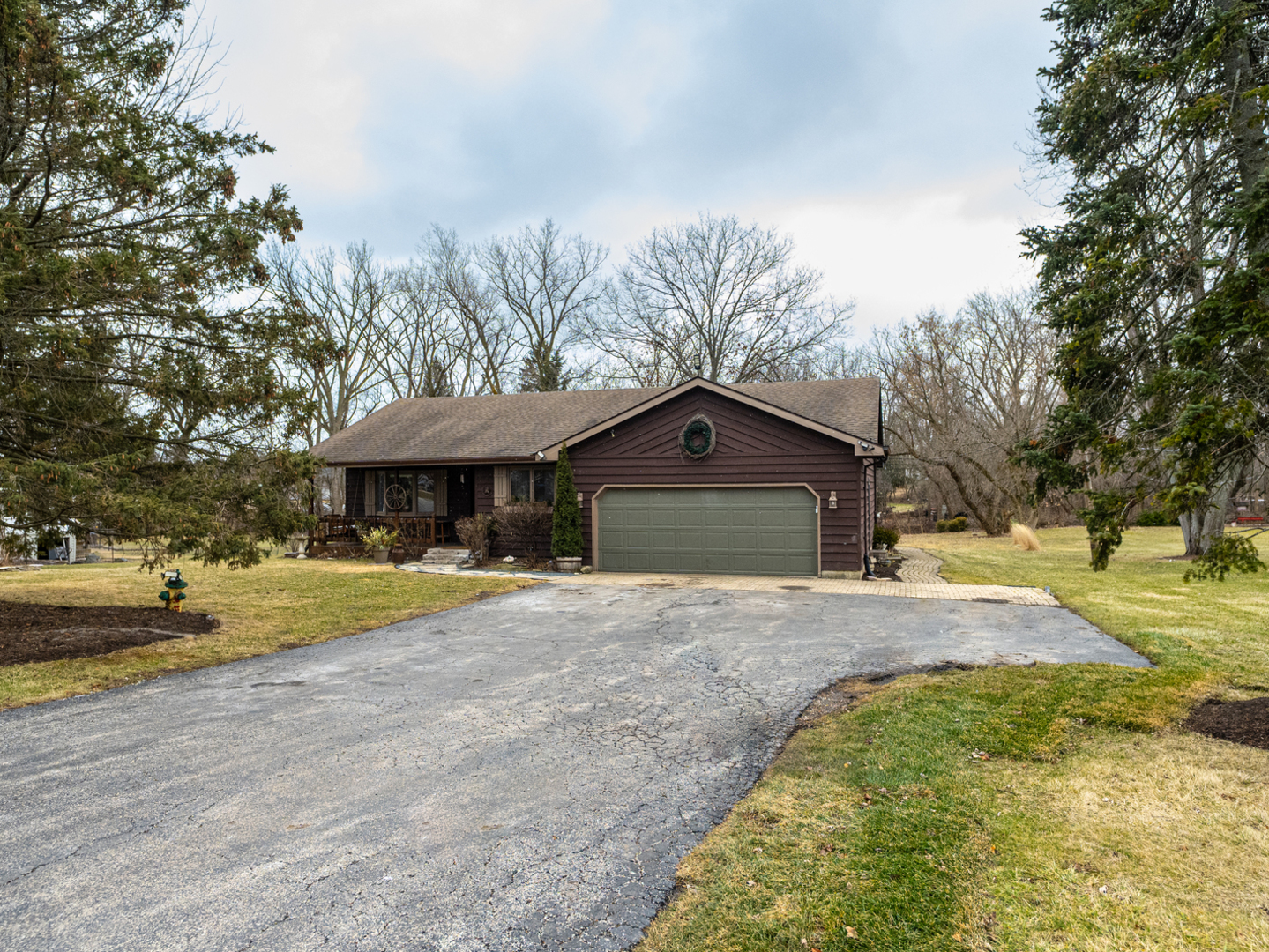 1403 West Beach Road Waukegan, IL 60087 - Photo 53 of 59 a front view of a house with a yard and garage