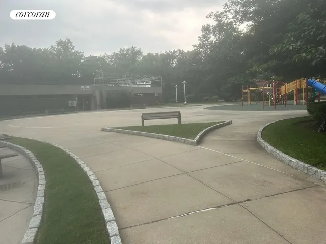 a view of a swimming pool with a yard