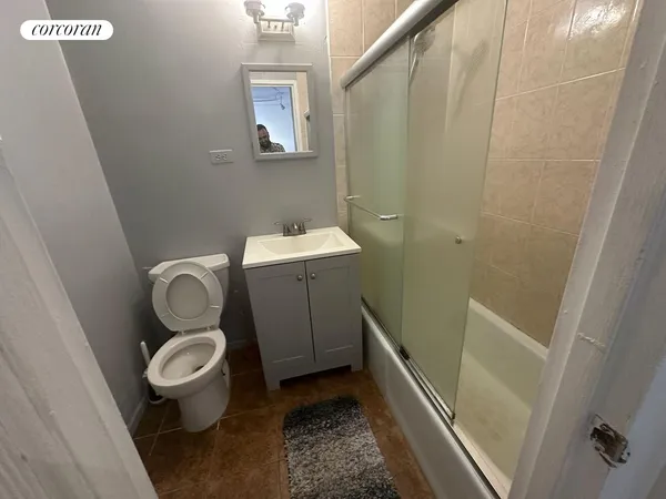 a bathroom with a toilet and a sink