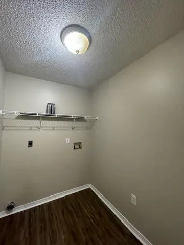 a view of a room with racks on the wall