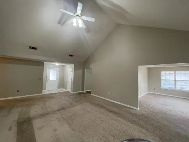 a view of an empty room with a window