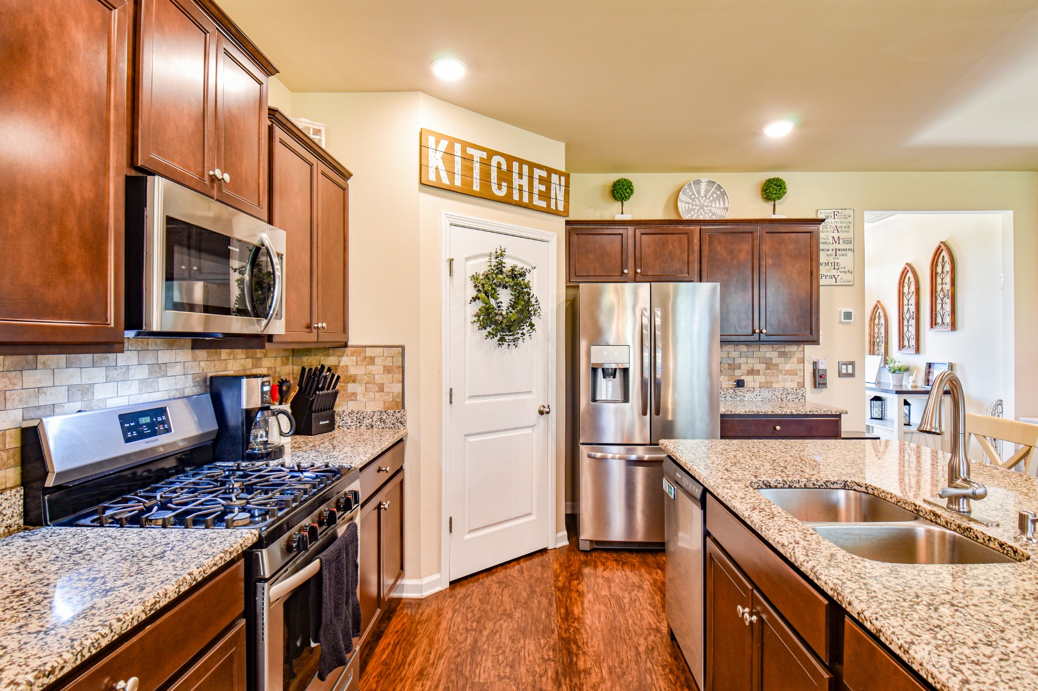 742 Prominence Road Columbia, TN 38401 - Photo 12 of 33 a kitchen with stainless steel appliances granite countertop a refrigerator a stove top oven a sink and dishwasher