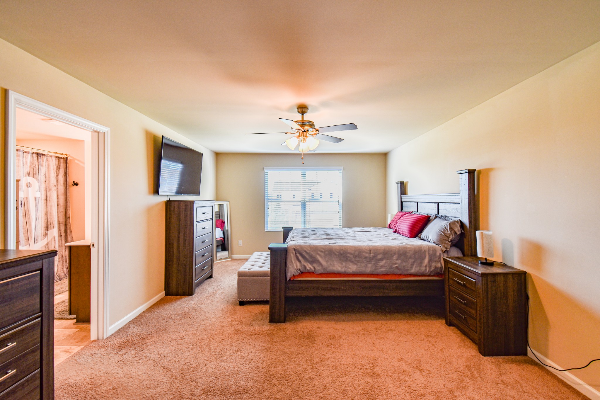 742 Prominence Road Columbia, TN 38401 - Photo 22 of 33 a bed room with a bed and a chandelier