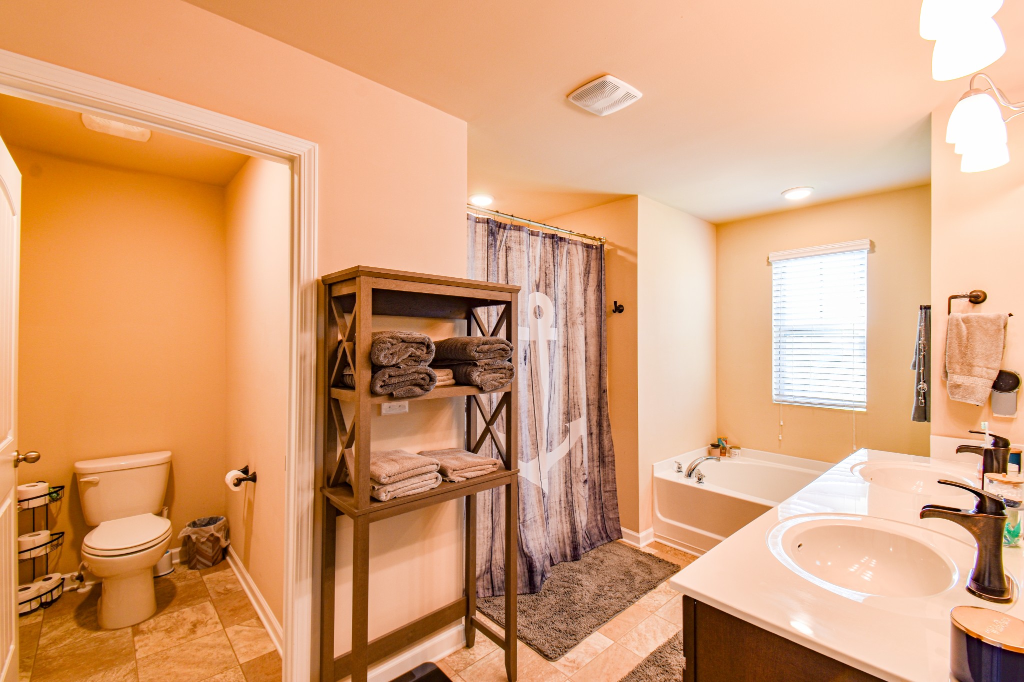 742 Prominence Road Columbia, TN 38401 - Photo 24 of 33 a bathroom with a granite countertop sink toilet and shower