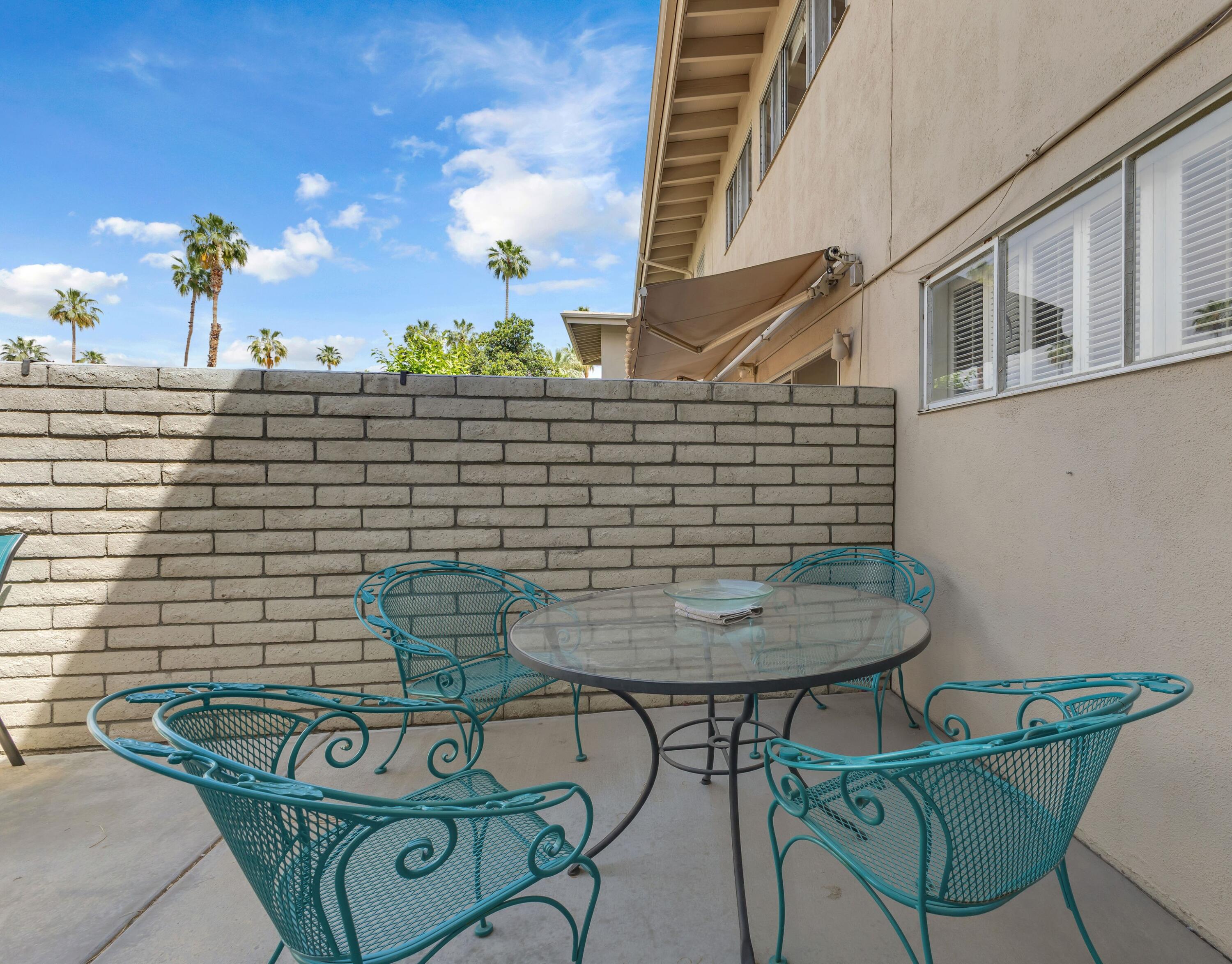 69850 Hwy 111 Rancho Mirage Ca, Unit 14 Rancho Mirage, CA 92270 - Photo 34 of 56 a view of entryway with a table and chairs