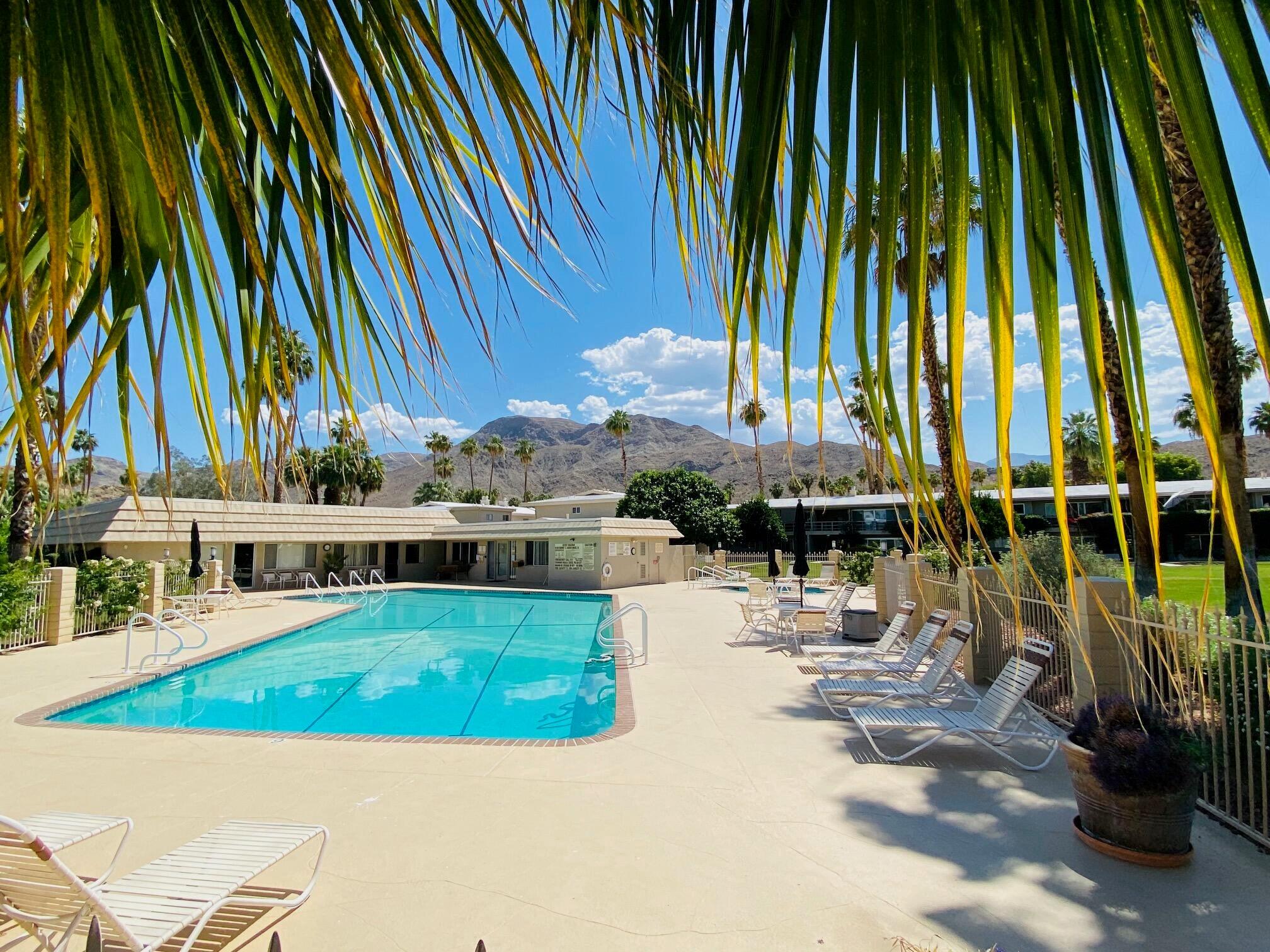 69850 Hwy 111 Rancho Mirage Ca, Unit 14 Rancho Mirage, CA 92270 - Photo 36 of 56 a view of a swimming pool with chairs