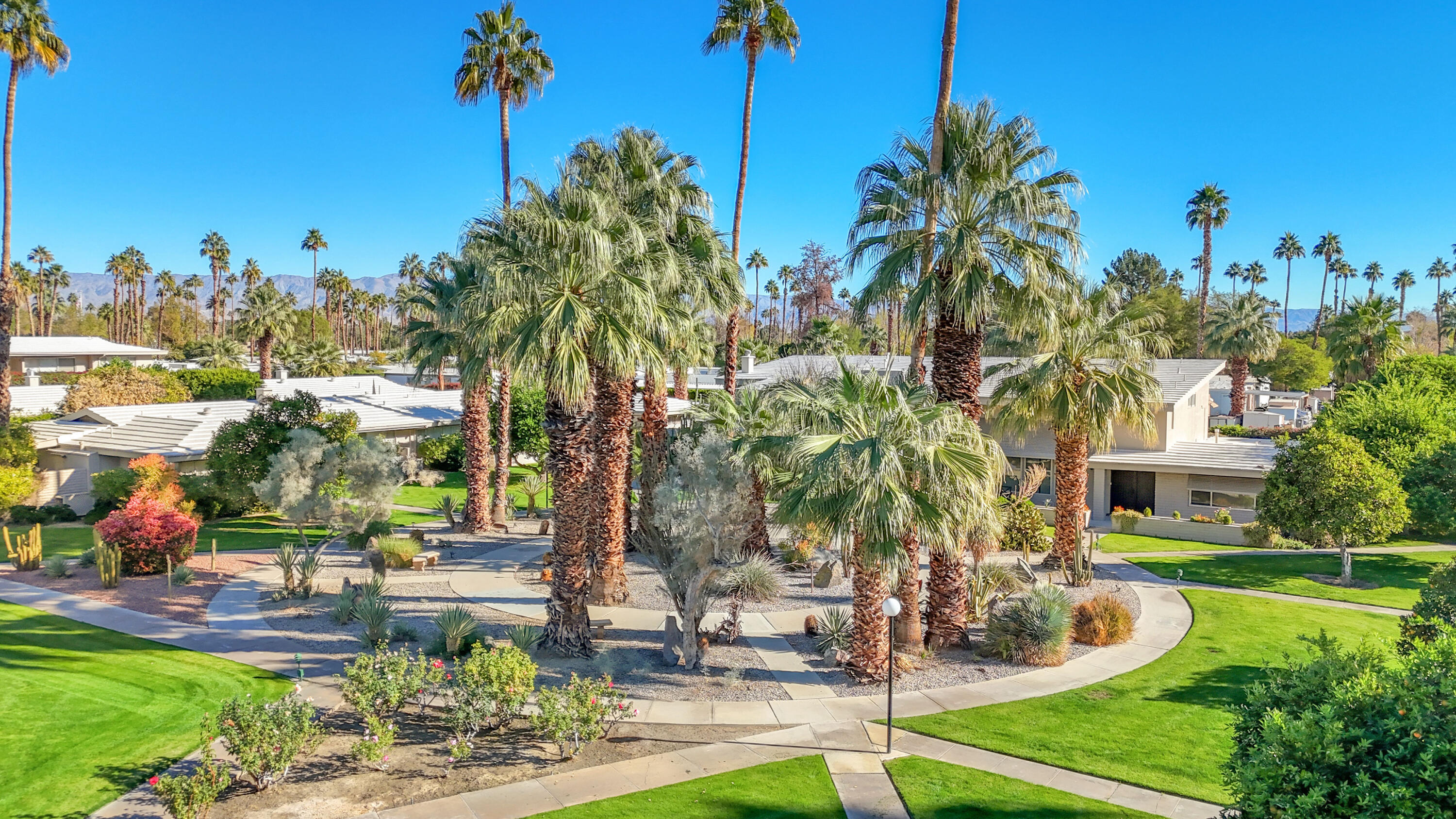 69850 Hwy 111 Rancho Mirage Ca, Unit 14 Rancho Mirage, CA 92270 - Photo 43 of 56 a view of a house with a yard and sitting area