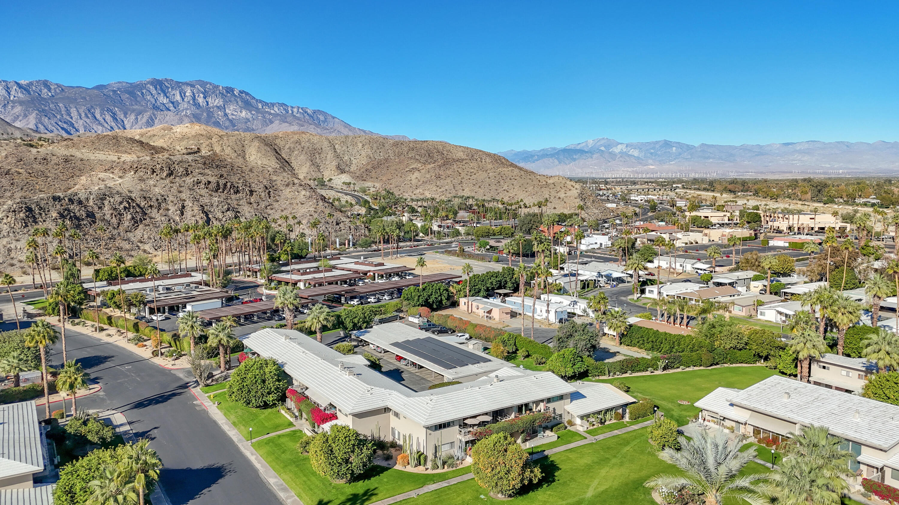 69850 Hwy 111 Rancho Mirage Ca, Unit 14 Rancho Mirage, CA 92270 - Photo 47 of 56 an aerial view of residential houses with outdoor space