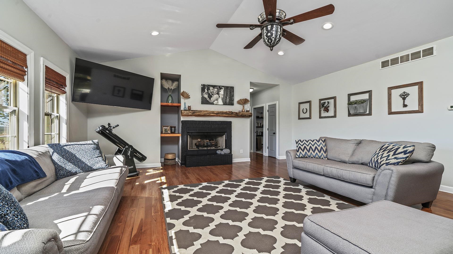 2586 Rogene Drive Oregon, IL 61061 - Photo 4 of 43 a living room with furniture a flat screen tv and a fireplace