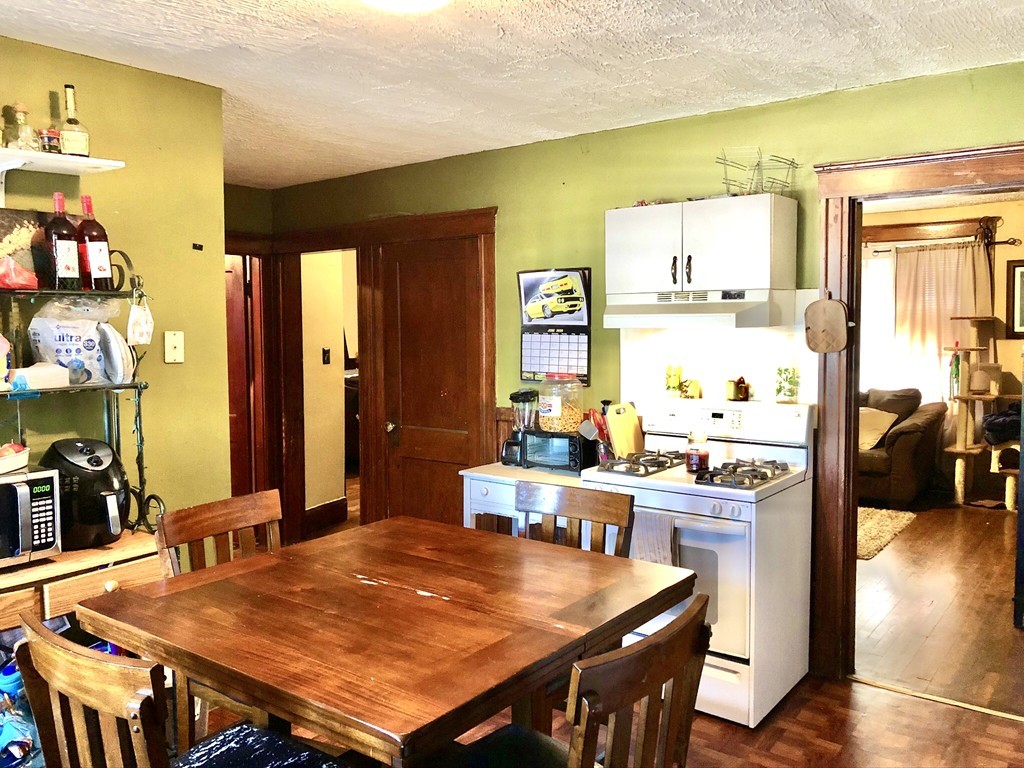 88 Congress Street, Unit 3 Salem, MA 01970 - Photo 2 of 15 a view of a dining room with furniture and wooden floor
