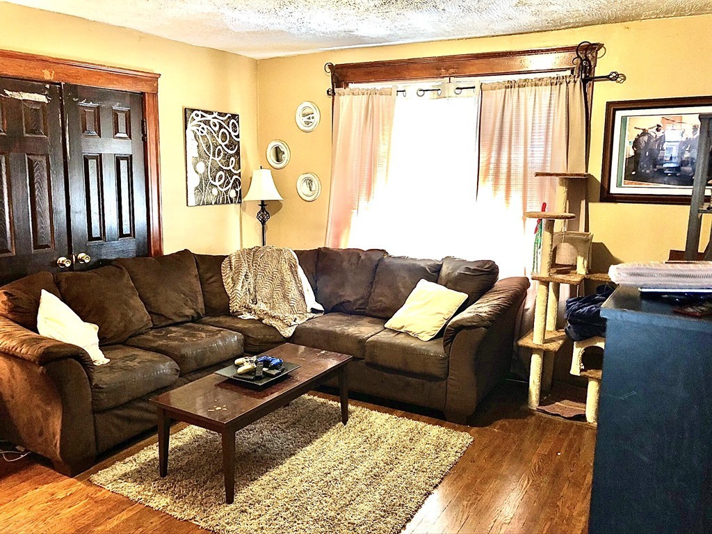 88 Congress Street, Unit 3 Salem, MA 01970 - Photo 8 of 15 a living room with furniture and a window