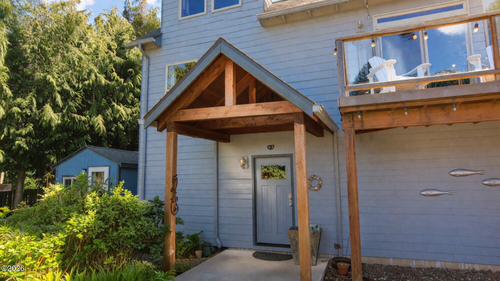 Cozy cottage entrance and backyard view_