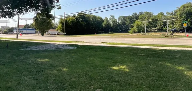 a view of a swimming pool with a yard