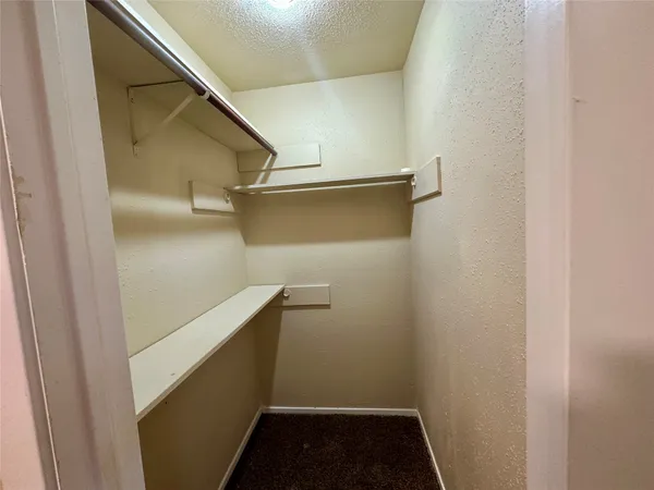 a white toilet and tub sitting next to a bathroom sink