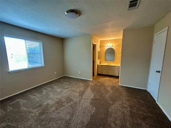a white toilet sitting next to a shower