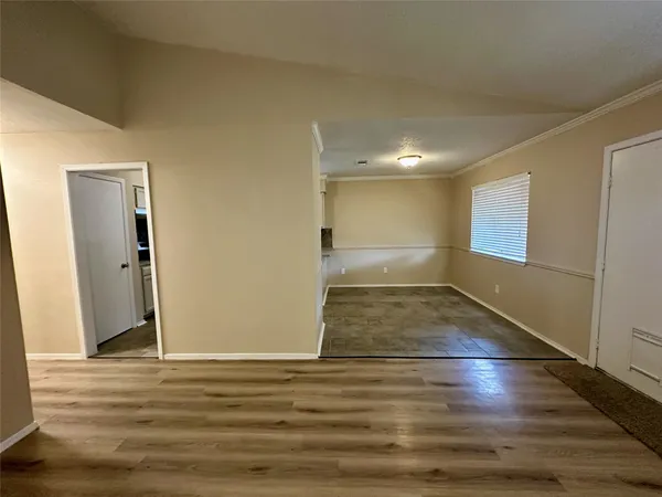 a view of a dining room with furniture and window
