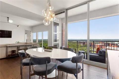 a view of a dining room with furniture window and outside view