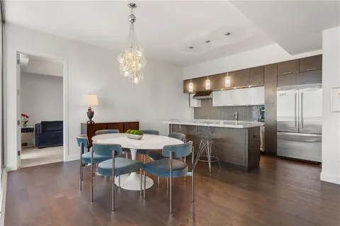 a kitchen with a table and chairs in it