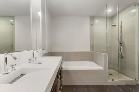a bathroom with a bathtub and a sink