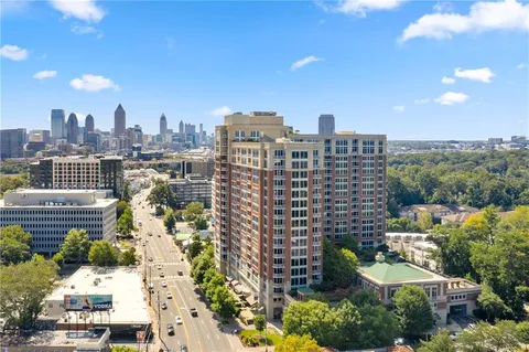 a view of a swimming pool with outdoor seating
