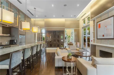 a room with pool table and windows