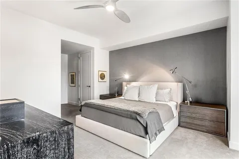 a bedroom with a bed and a couch