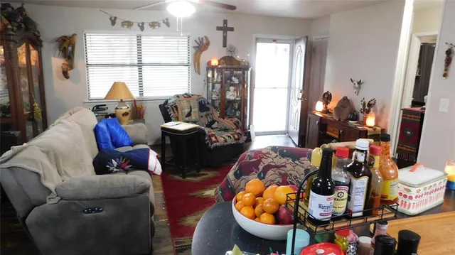 a living room filled with furniture and a flat screen tv