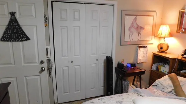 a view of a hallway with paintings on the wall