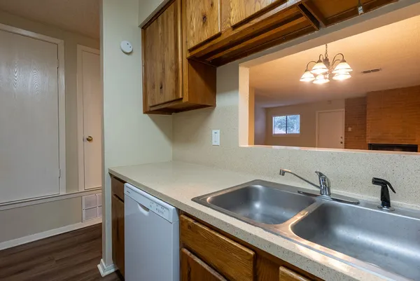 a view white cabinets and a sink