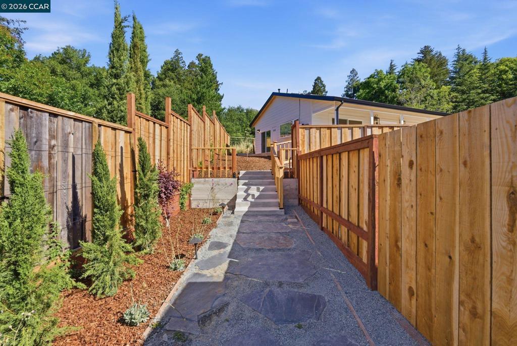 3196 Rohrer Drive Lafayette, CA 94549 - Photo 30 of 30 a view of a pathway with a wrought fence