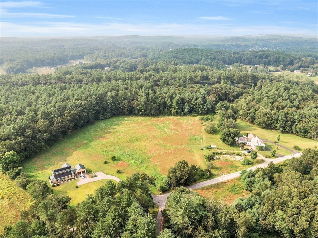 295 Pond Street Dunstable, MA 01827 - Photo 13 of 14 an aerial view of residential houses with outdoor space and lake view